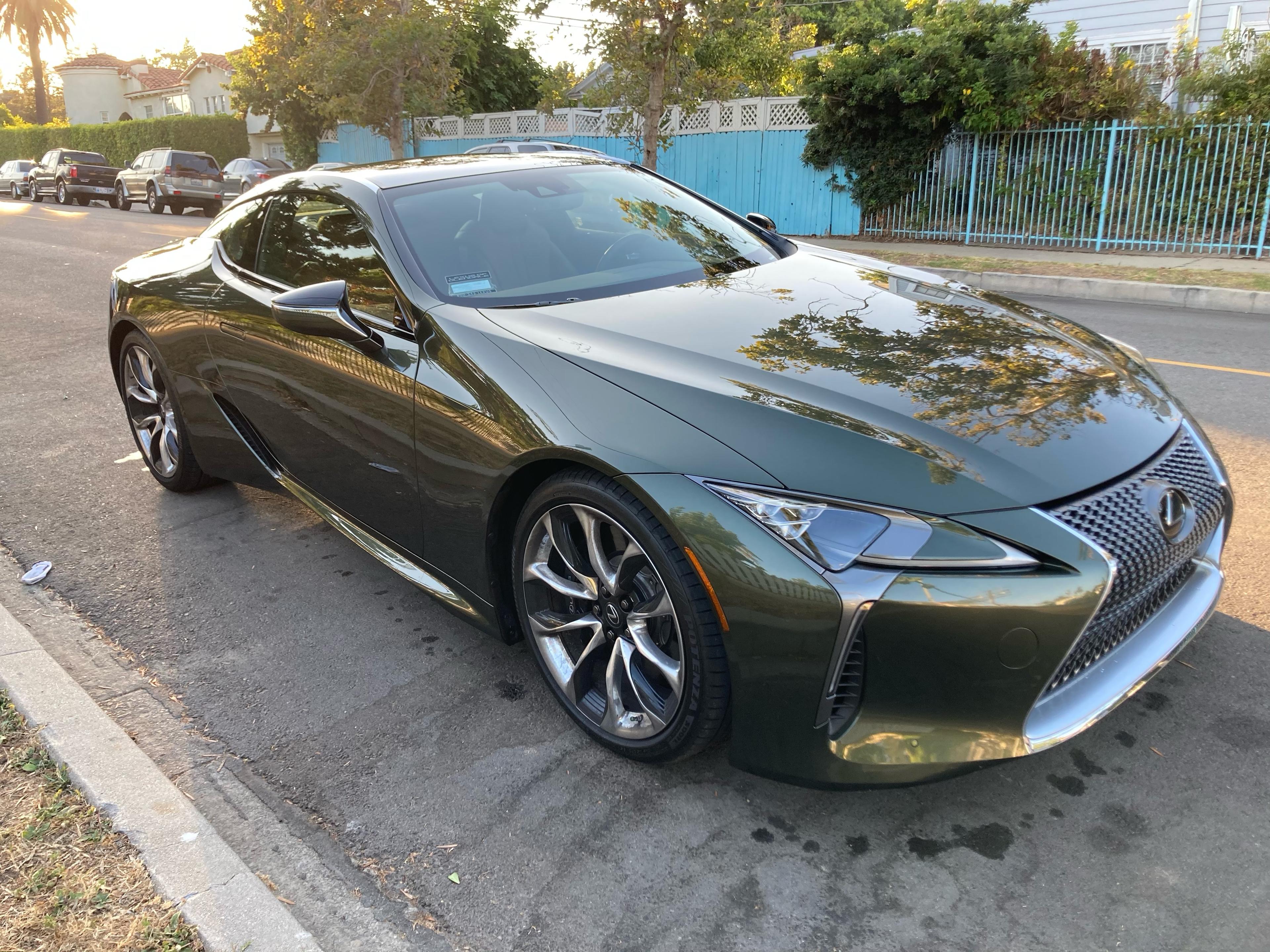 After repair: the same green Lexus LC from the same front driver-side angle